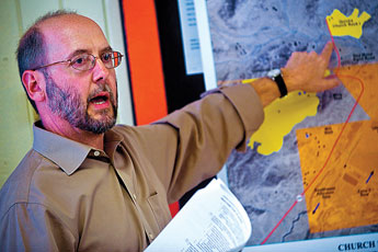 Clancy Tenley of the US Environmental Protection agency gestures to a map of the area during a discussion about the clean-up of the Northeast Church Rock mine at the Church Rock chapter house Thursday. © 2011 Gallup Independent / Cable Hoover 
